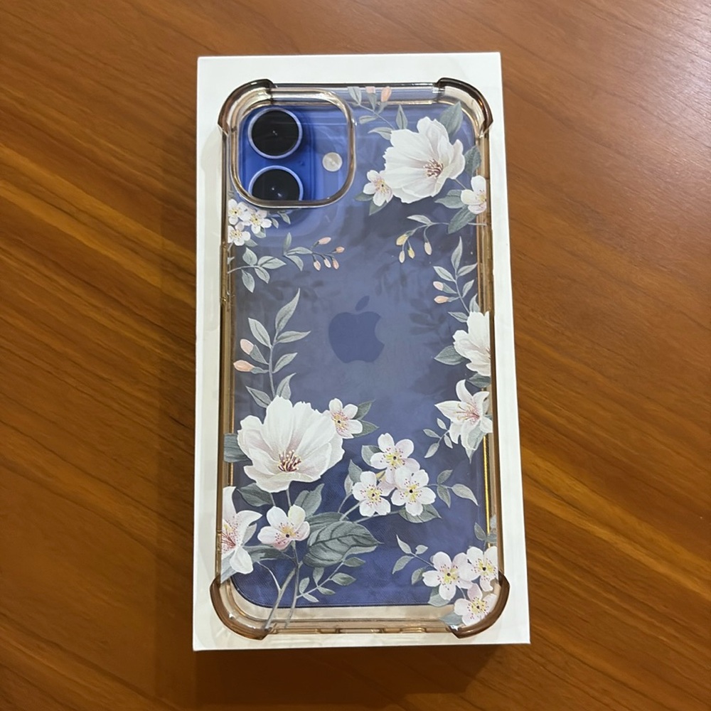 Floral Clear I Phone 14 Case, Shiws the color of the phone from underneath.
